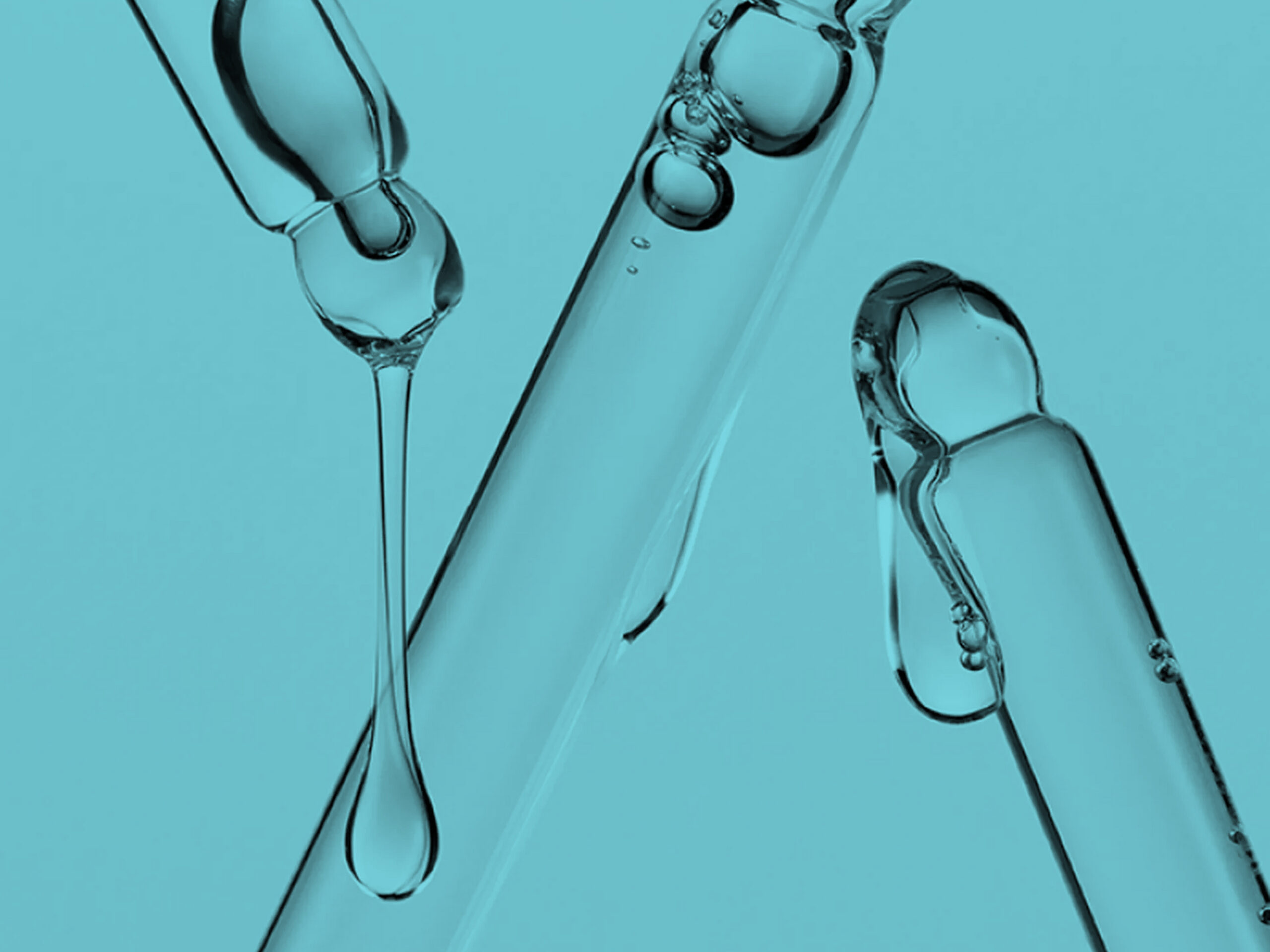 Close-up of clear glass droppers with liquid droplets suspended inside, set against a solid aqua background